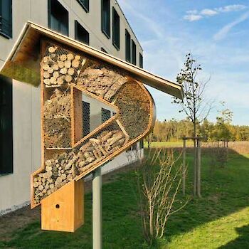 An insect hotel in the shape of a DEKRA D