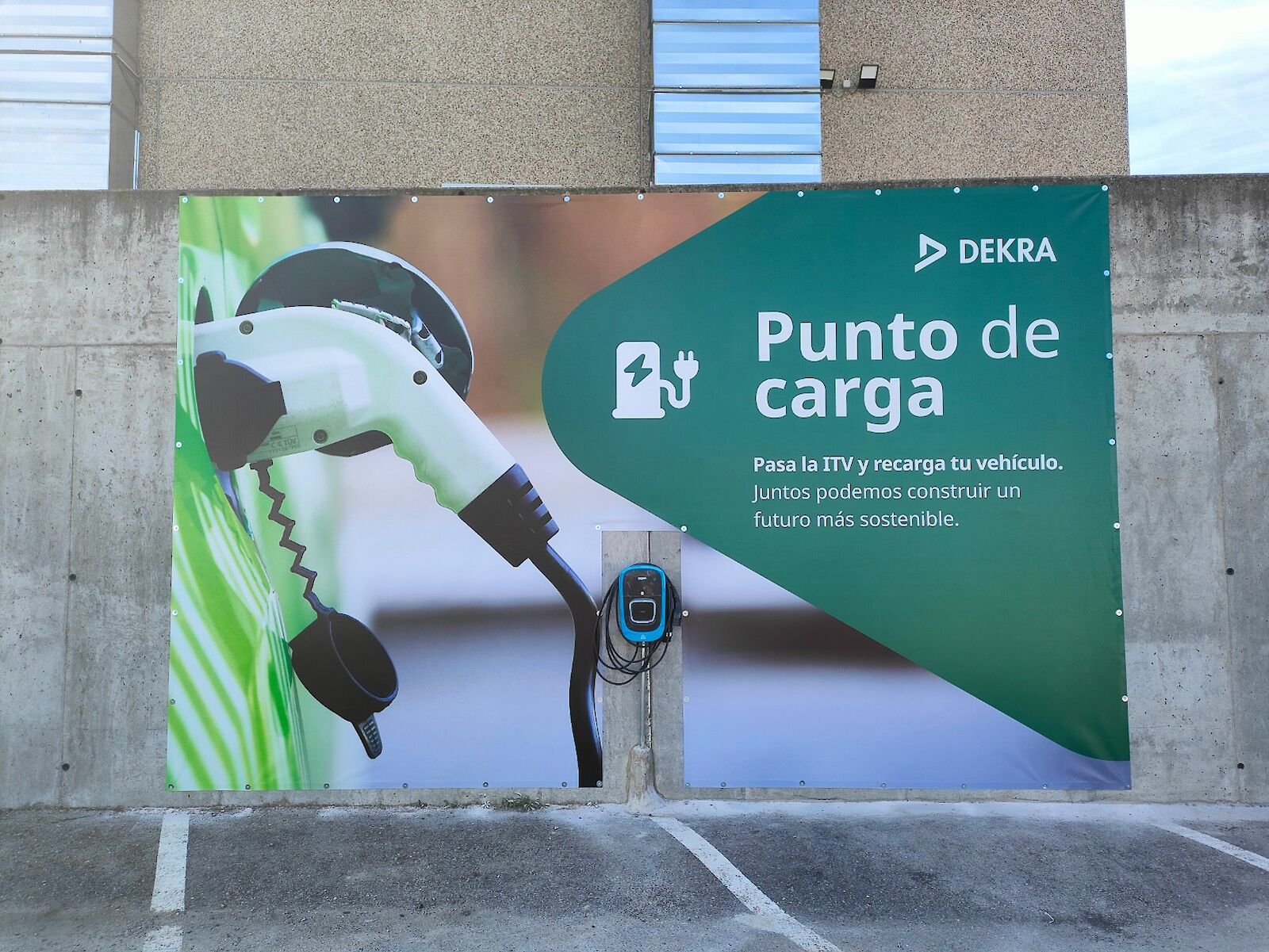 An electric charging station in a parking lot