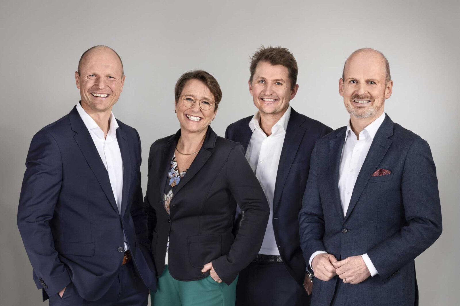 Group photo of the four members of the DEKRA board of Management: Stan Zurkiewicz, Petra Finke, Peter Laursen and Wolfgang Linsenmaier